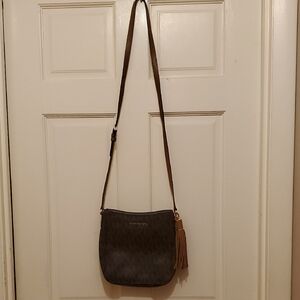 Michael Kors Momogram Brown canvas and Tan Leather Trim.9inw Crossbody.